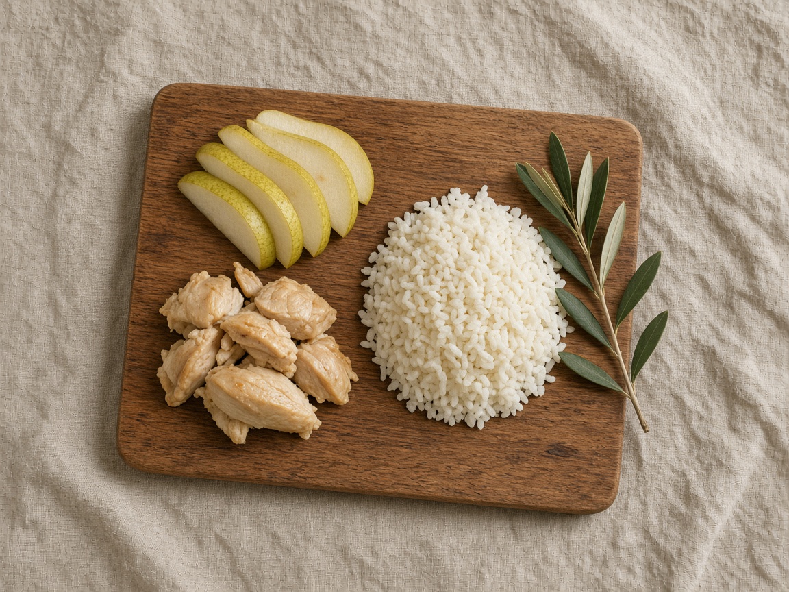 A wooden board with pear, rice, and cooked chicken, and no labels.